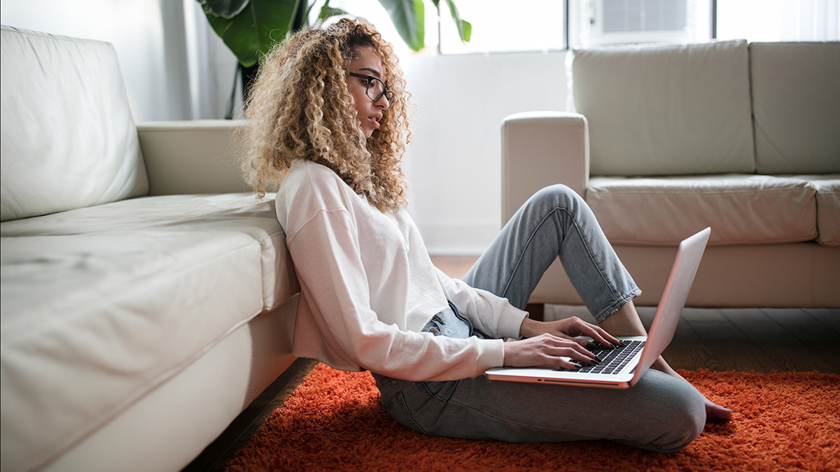 woman composing business email laptop